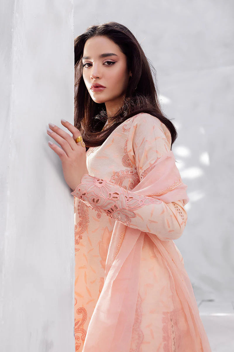 Model wearing peach pink Mitchelle from Mushq La Toscana Casual Pret '25, Pakistani luxury pret and Pakistani clothes online in UK.