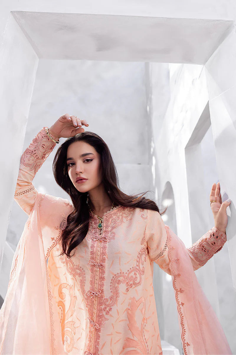 Model wearing peach pink Mitchelle from Mushq La Toscana Casual Pret '25, Pakistani luxury pret and Pakistani clothes online in UK.