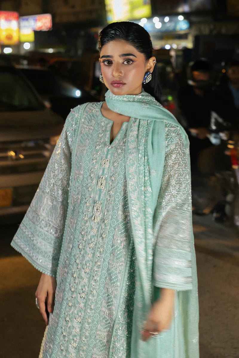 Model wearing Mushq Saugaat City of Lights Shama in mint green with intricate embroidery and embellishments. Shop Pakistani luxury pret online in the UK.