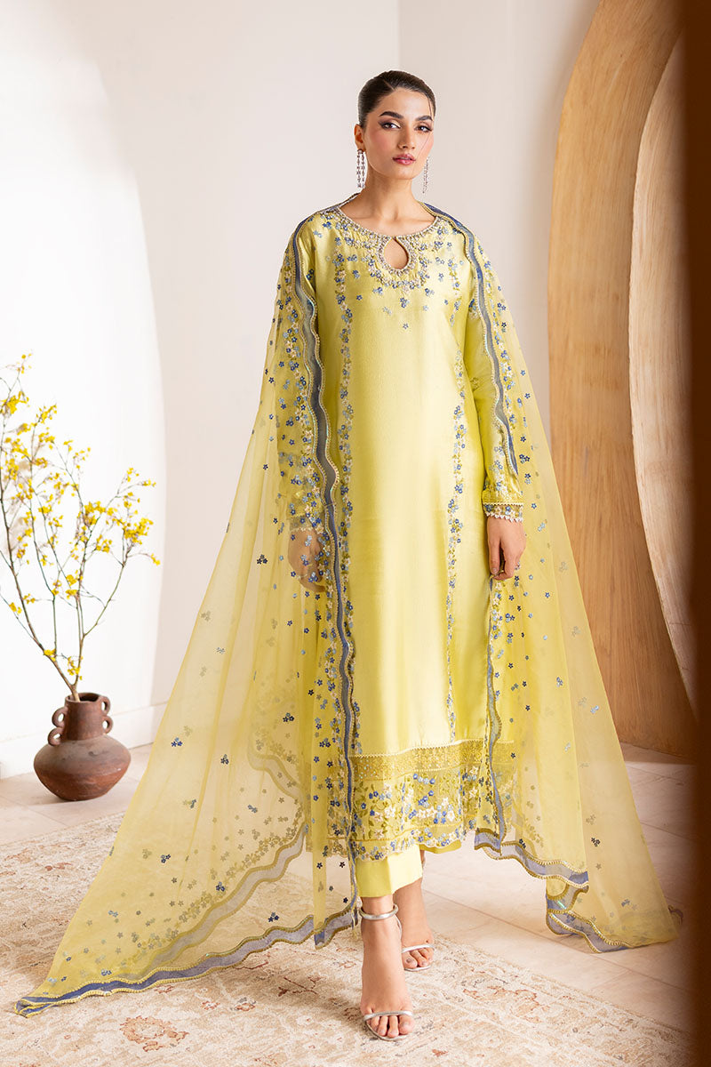 Model wearing lemon yellow Lumiere dress from Mushq with delicate blue embroidery, perfect for Pakistani luxury pret and clothes online in UK.