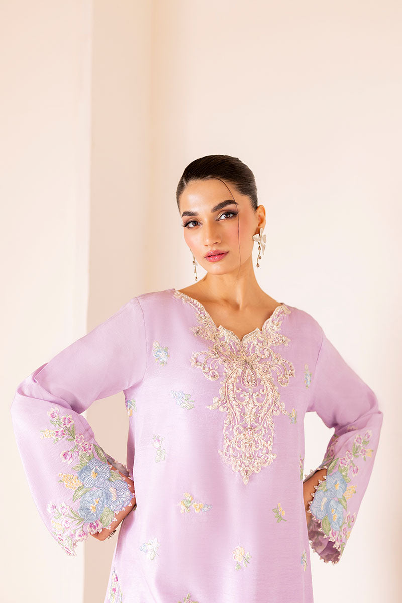 Model wearing pastel lilac embroidered outfit Serin from Mushq, featuring Pakistani luxury pret and Pakistani clothes online in UK.