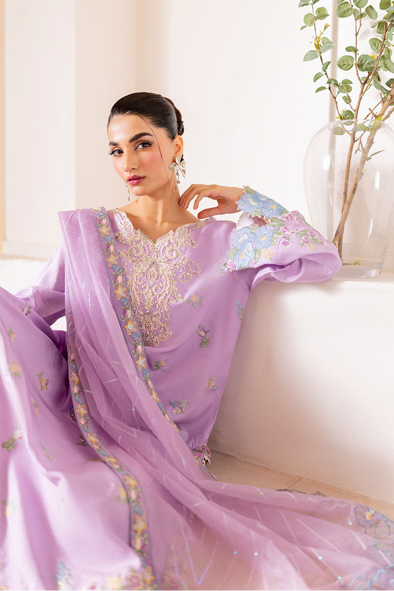 Model wearing pastel lilac embroidered outfit Serin from Mushq, featuring Pakistani luxury pret and Pakistani clothes online in UK.