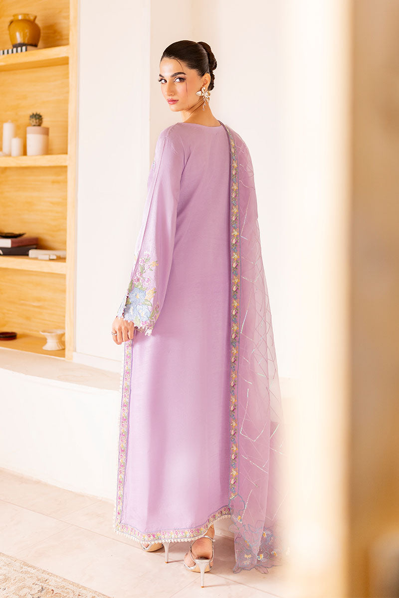 Model wearing pastel lilac embroidered outfit Serin from Mushq, featuring Pakistani luxury pret and Pakistani clothes online in UK.