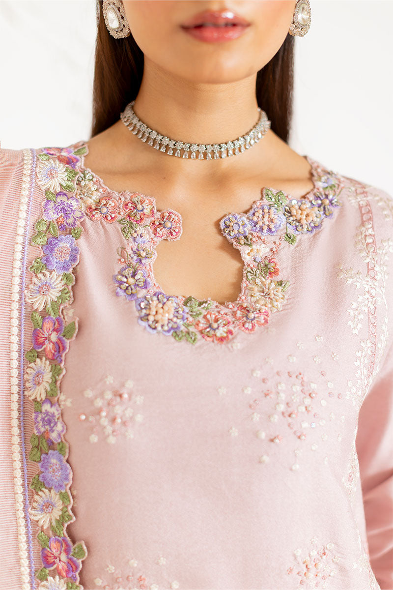 Model wearing blush pink embroidered Reyna outfit from Mushq, ideal for Pakistani luxury pret and Pakistani clothes online in UK.