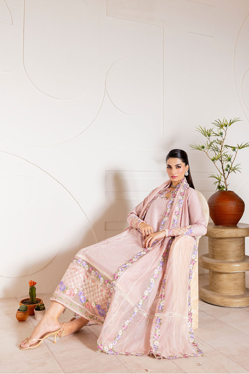 Model wearing blush pink embroidered Reyna outfit from Mushq, ideal for Pakistani luxury pret and Pakistani clothes online in UK.