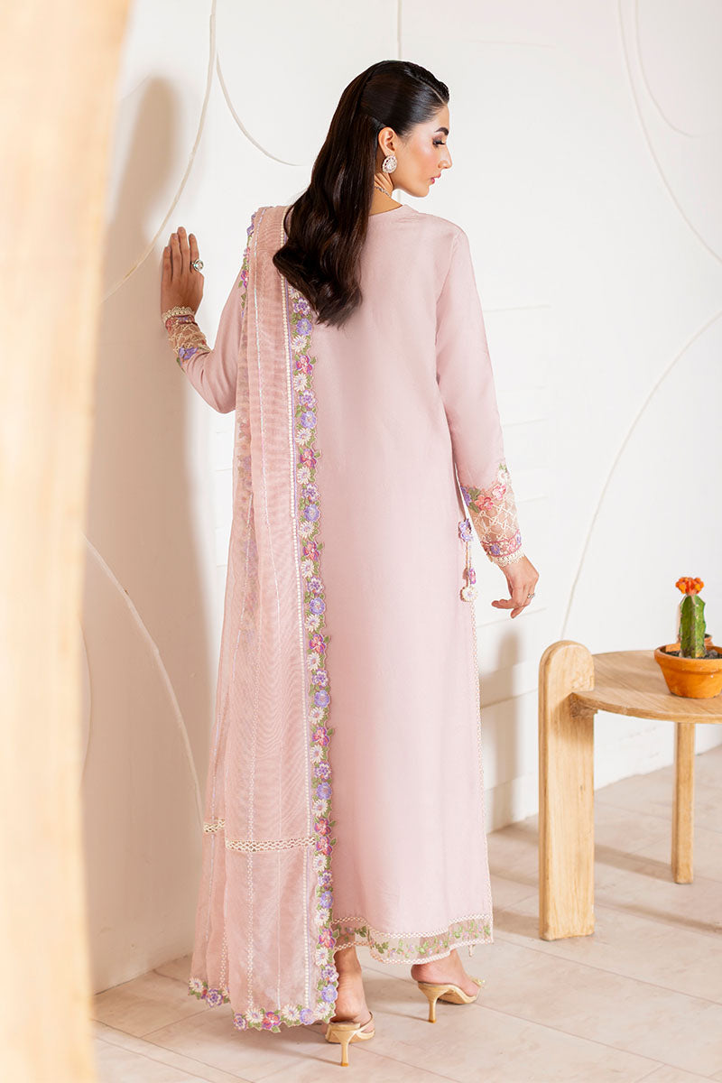 Model wearing blush pink embroidered Reyna outfit from Mushq, ideal for Pakistani luxury pret and Pakistani clothes online in UK.