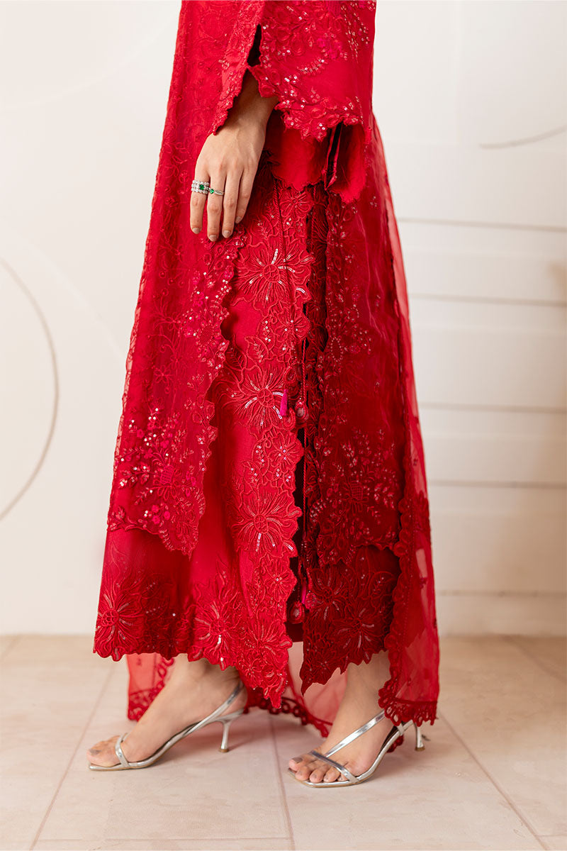 Model wearing deep red Rubea dress from Mushq, featuring intricate embroidery for Pakistani luxury pret and Pakistani clothes online in UK.