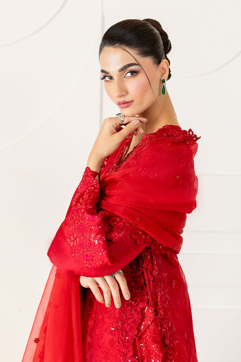 Model wearing deep red Rubea dress from Mushq, featuring intricate embroidery for Pakistani luxury pret and Pakistani clothes online in UK.