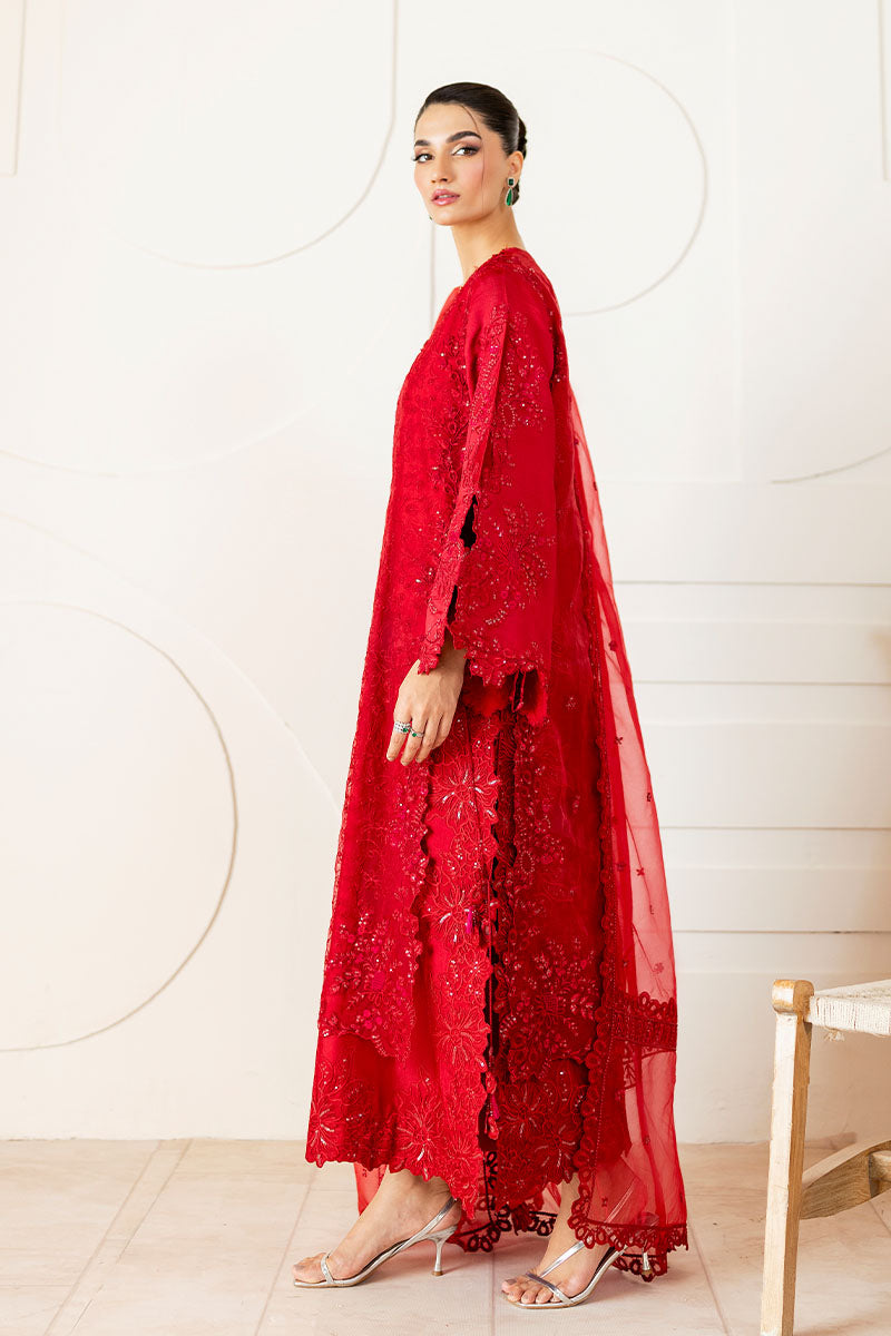Model wearing deep red Rubea dress from Mushq, featuring intricate embroidery for Pakistani luxury pret and Pakistani clothes online in UK.