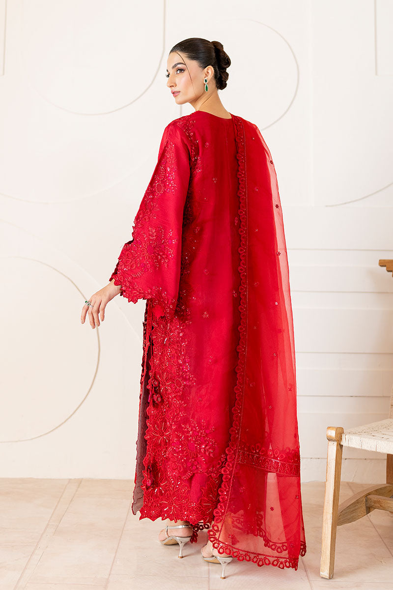 Model wearing deep red Rubea dress from Mushq, featuring intricate embroidery for Pakistani luxury pret and Pakistani clothes online in UK.