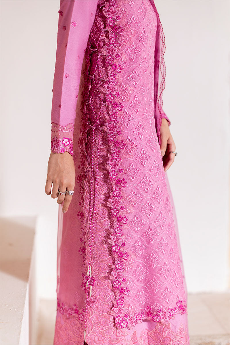 Model wearing blush pink embroidered Reyna outfit from Mushq, ideal for Pakistani luxury pret and Pakistani clothes online in UK.