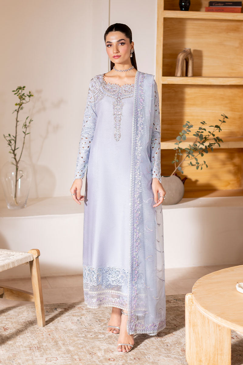Model wearing ice blue Verve dress from Mushq, showcasing elegant embroidery for Pakistani luxury pret and Pakistani clothes online in UK.