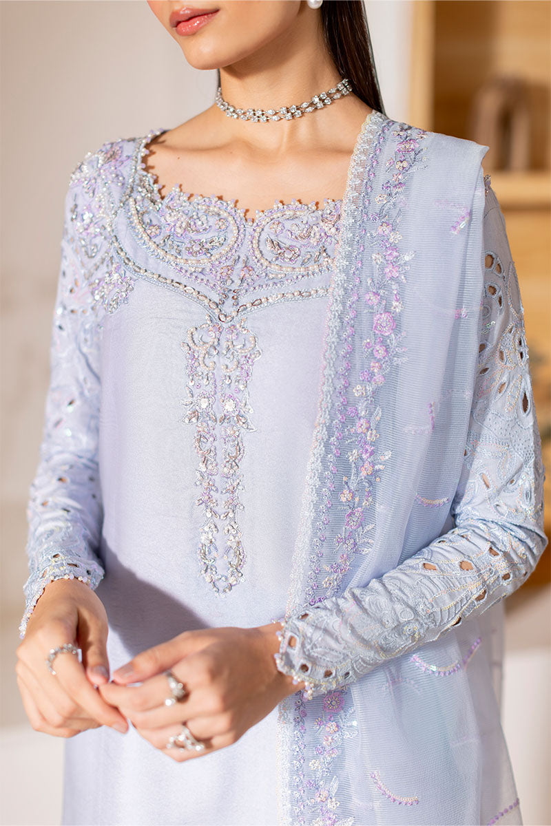 Model wearing ice blue Verve dress from Mushq, showcasing elegant embroidery for Pakistani luxury pret and Pakistani clothes online in UK.