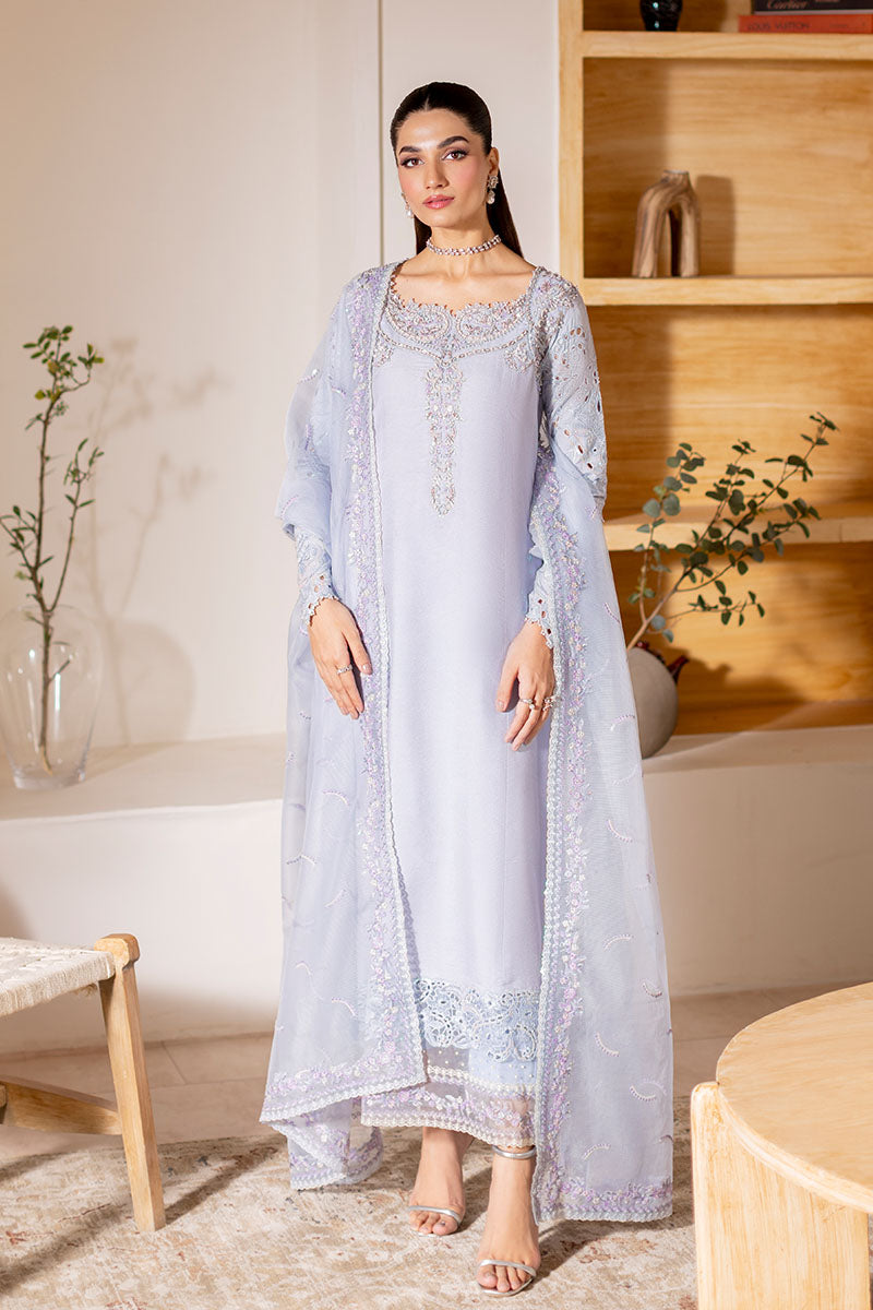 Model wearing ice blue Verve dress from Mushq, showcasing elegant embroidery for Pakistani luxury pret and Pakistani clothes online in UK.