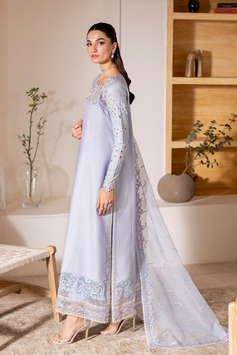 Model wearing ice blue Verve dress from Mushq, showcasing elegant embroidery for Pakistani luxury pret and Pakistani clothes online in UK.