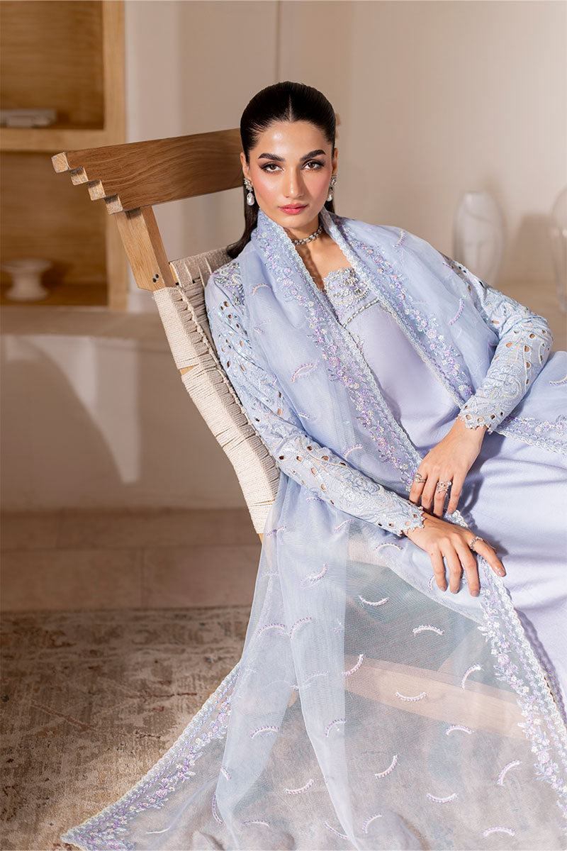 Model wearing ice blue Verve dress from Mushq, showcasing elegant embroidery for Pakistani luxury pret and Pakistani clothes online in UK.