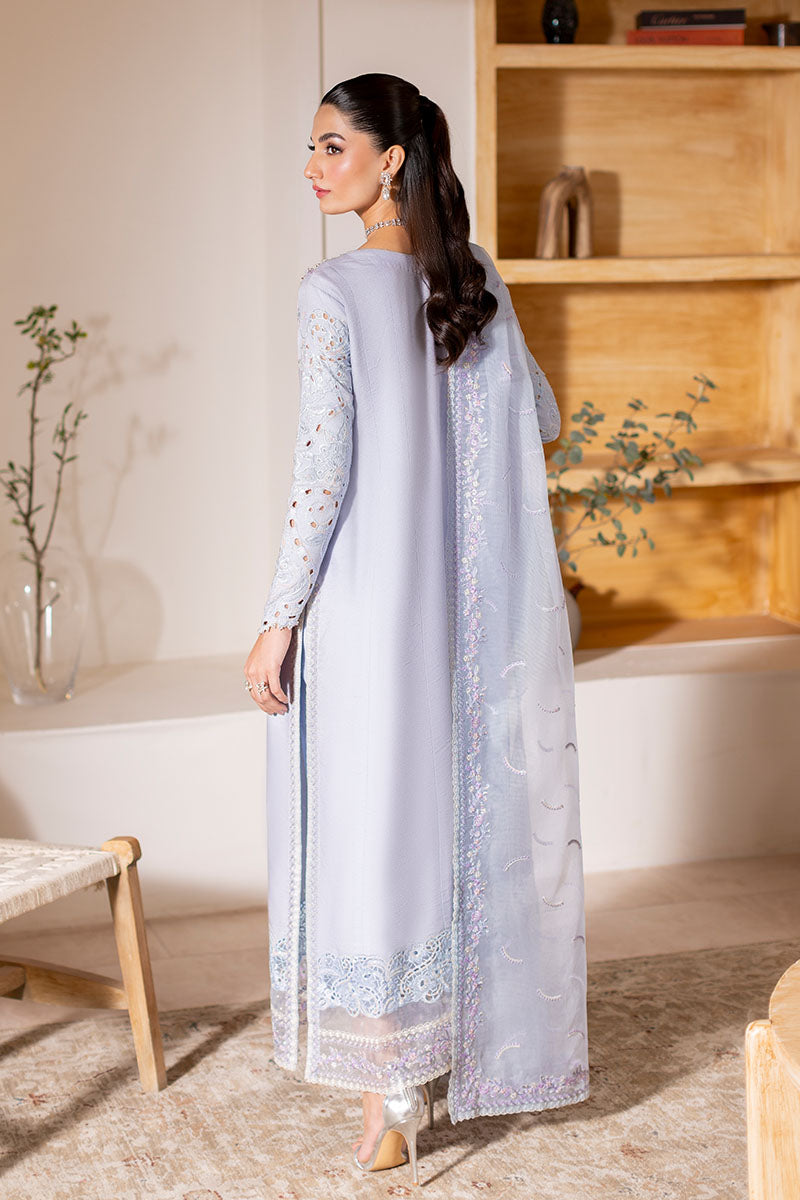 Model wearing ice blue Verve dress from Mushq, showcasing elegant embroidery for Pakistani luxury pret and Pakistani clothes online in UK.