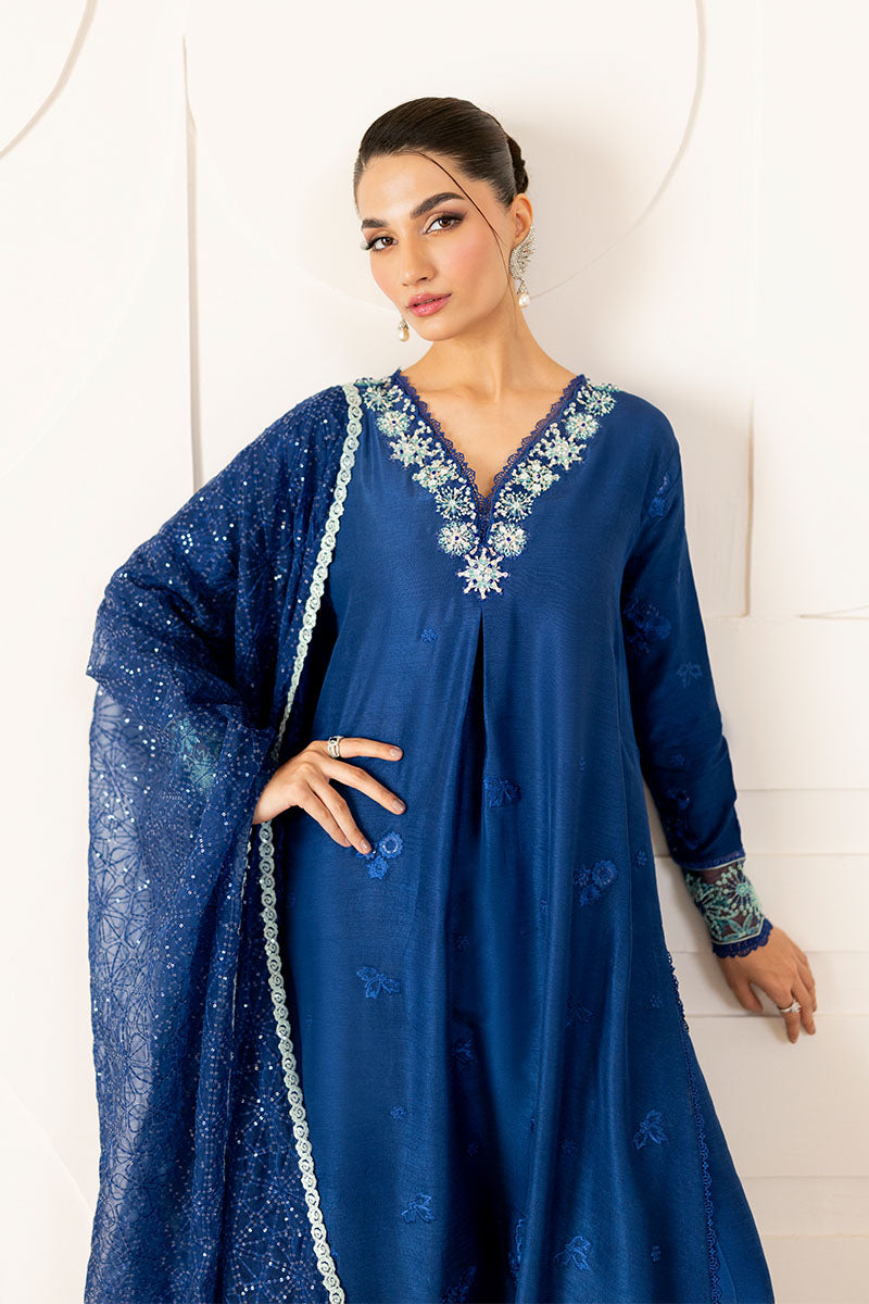 Model wearing deep navy blue embroidered Kayra dress from Mushq, ideal for Pakistani luxury pret and Pakistani clothes online in UK.