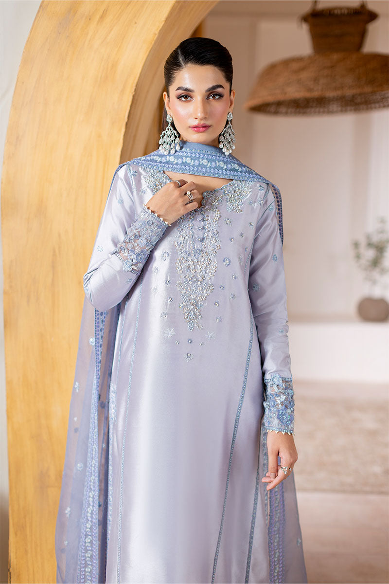 Model wearing lilac Elya dress from Mushq with hand-embellished details, perfect for Pakistani luxury pret and Pakistani clothes online in UK.