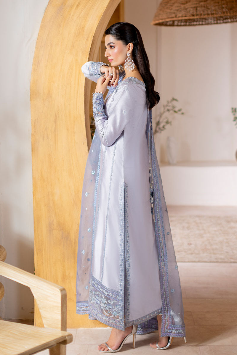 Model wearing lilac Elya dress from Mushq with hand-embellished details, perfect for Pakistani luxury pret and Pakistani clothes online in UK.