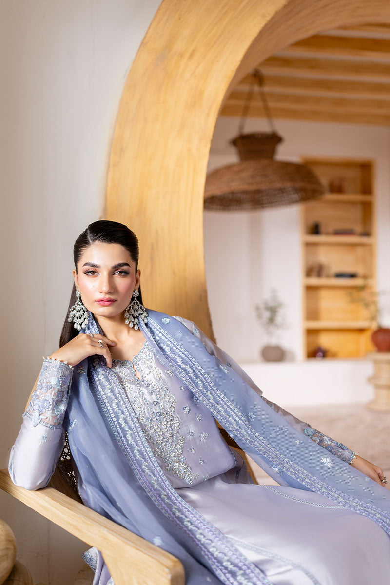 Model wearing lilac Elya dress from Mushq with hand-embellished details, perfect for Pakistani luxury pret and Pakistani clothes online in UK.