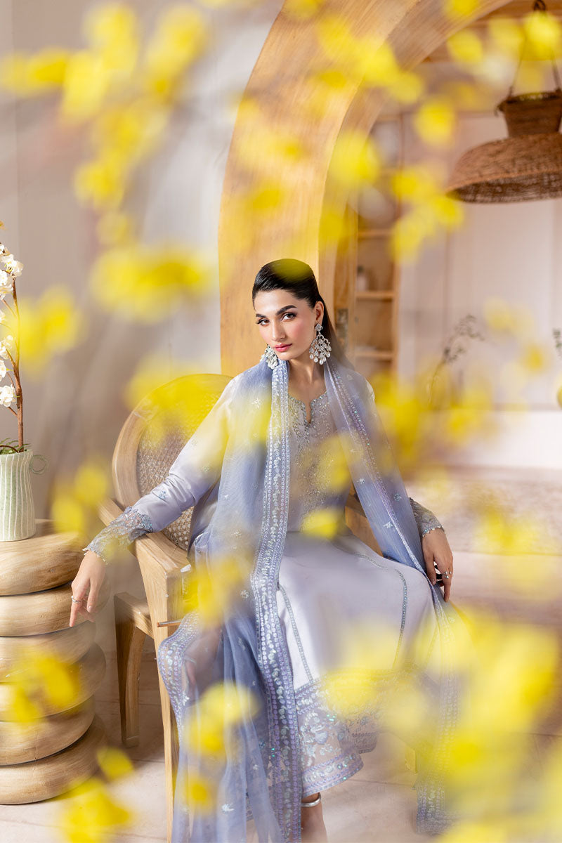 Model wearing lilac Elya dress from Mushq with hand-embellished details, perfect for Pakistani luxury pret and Pakistani clothes online in UK.