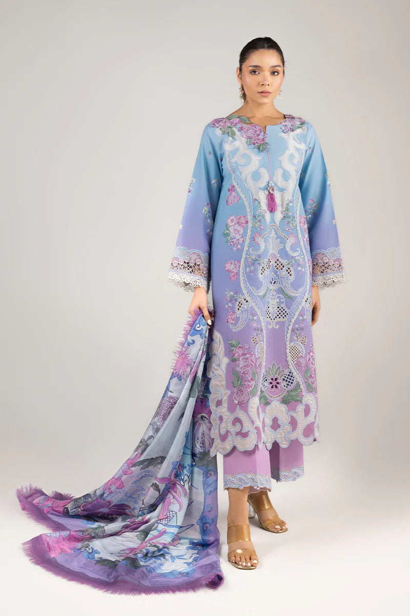 Model wearing lilac and aqua embroidered dress from Mushq Manaram Luxury Lawn '25 Whispering Melody, Pakistani luxury pret online in UK.