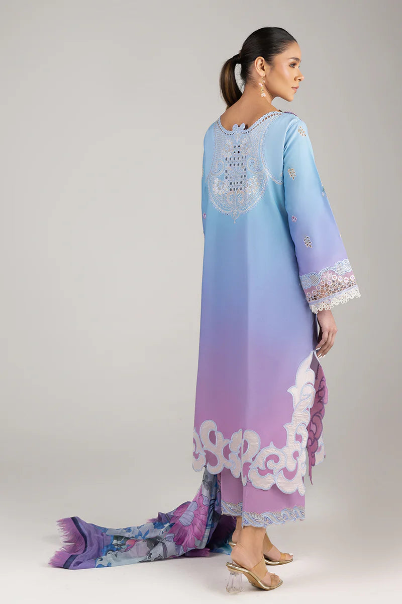 Model wearing lilac and aqua embroidered dress from Mushq Manaram Luxury Lawn '25 Whispering Melody, Pakistani luxury pret online in UK.