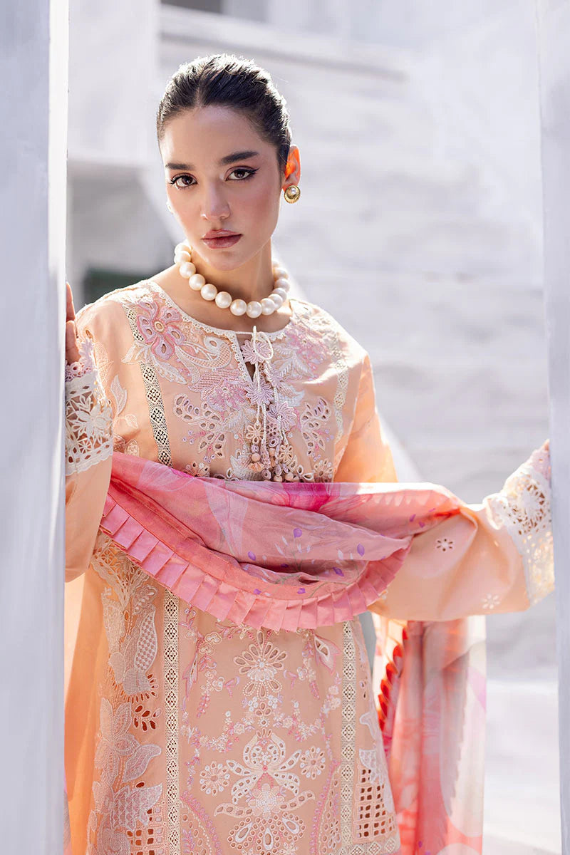 Model wearing peach embroidered dress with floral dupatta from Mushq Manaram Luxury Lawn '25 Dreamlike Vibe, Pakistani clothes online in UK.