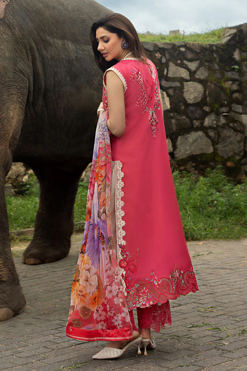 Model wearing coral red sleeveless embroidered dress with floral dupatta from Mushq Manaram Luxury Lawn '25 Eternal Radiance, Pakistani clothes online in UK.