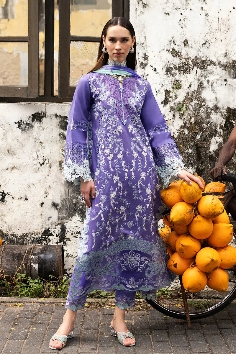 Model wearing purple embroidered dress with mint accents from Mushq Manaram Luxury Lawn '25 Luminous Essence, Pakistani clothes online in UK.