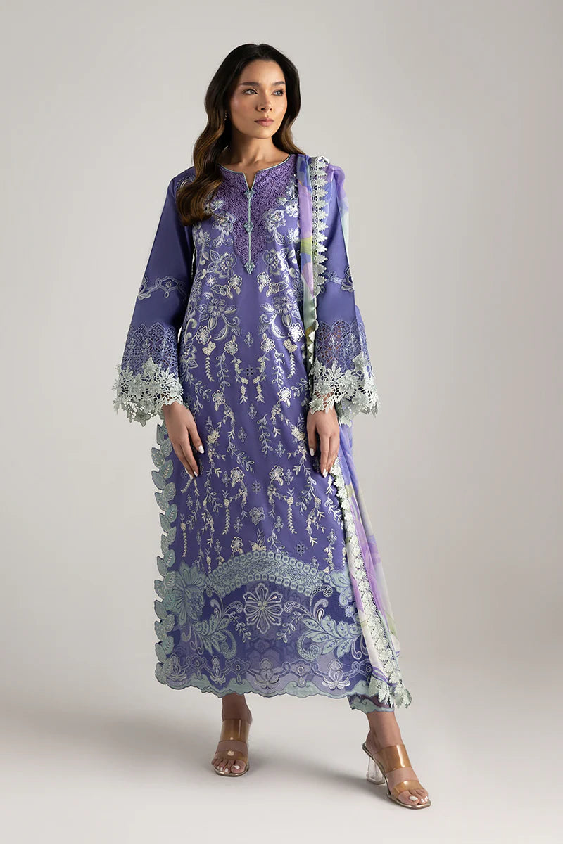 Model wearing purple embroidered dress with mint accents from Mushq Manaram Luxury Lawn '25 Luminous Essence, Pakistani clothes online in UK.