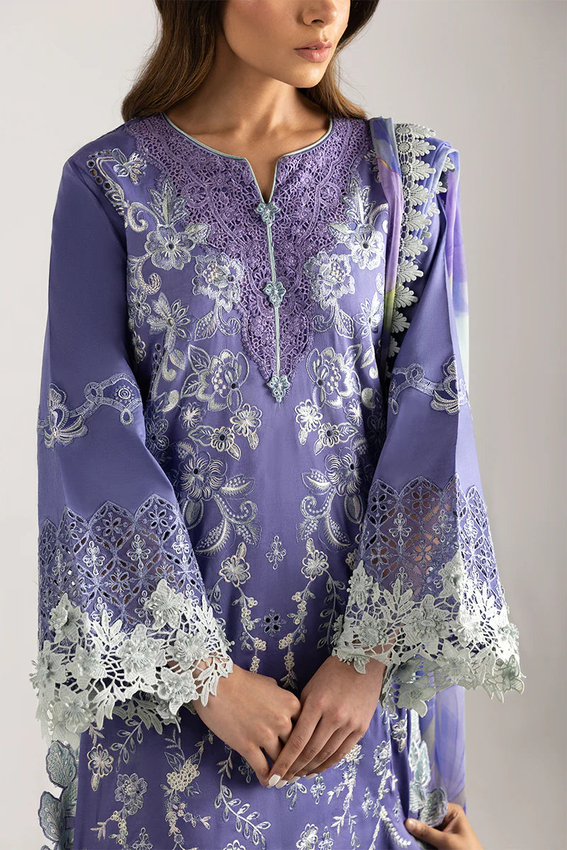 Model wearing purple embroidered dress with mint accents from Mushq Manaram Luxury Lawn '25 Luminous Essence, Pakistani clothes online in UK.