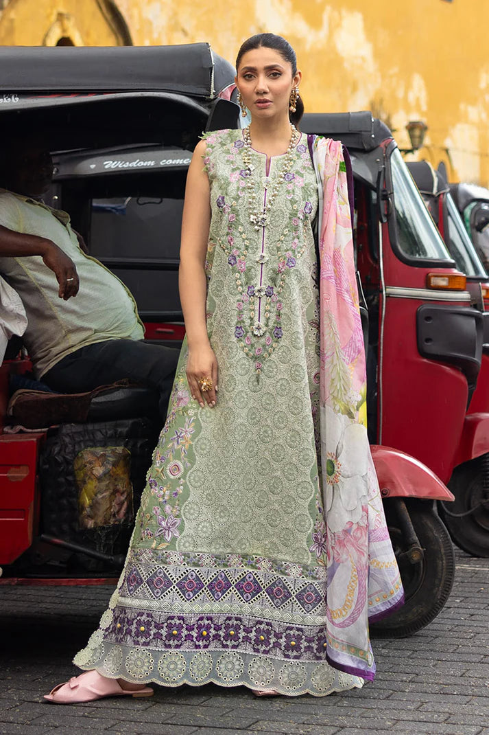 Model wearing sleeveless pastel green embroidered dress with floral pink dupatta from Mushq Manaram Luxury Lawn '25 Beaming Drift, Pakistani clothes online in UK.