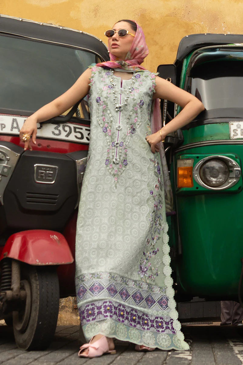 Model wearing sleeveless pastel green embroidered dress with floral pink dupatta from Mushq Manaram Luxury Lawn '25 Beaming Drift, Pakistani clothes online in UK.