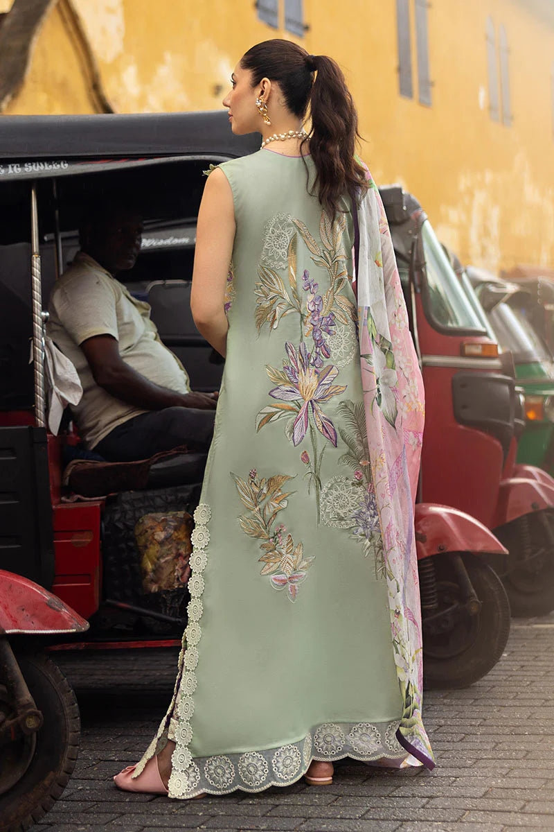 Model wearing sleeveless pastel green embroidered dress with floral pink dupatta from Mushq Manaram Luxury Lawn '25 Beaming Drift, Pakistani clothes online in UK.