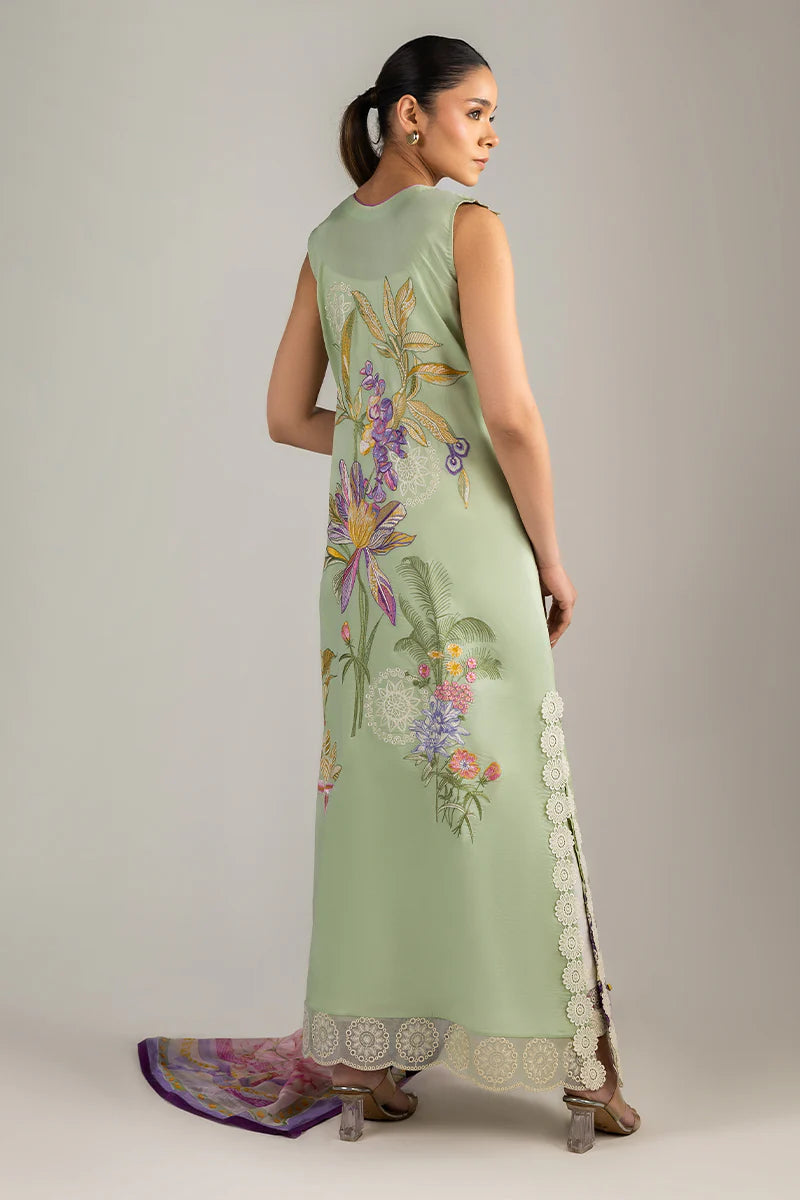 Model wearing sleeveless pastel green embroidered dress with floral pink dupatta from Mushq Manaram Luxury Lawn '25 Beaming Drift, Pakistani clothes online in UK.
