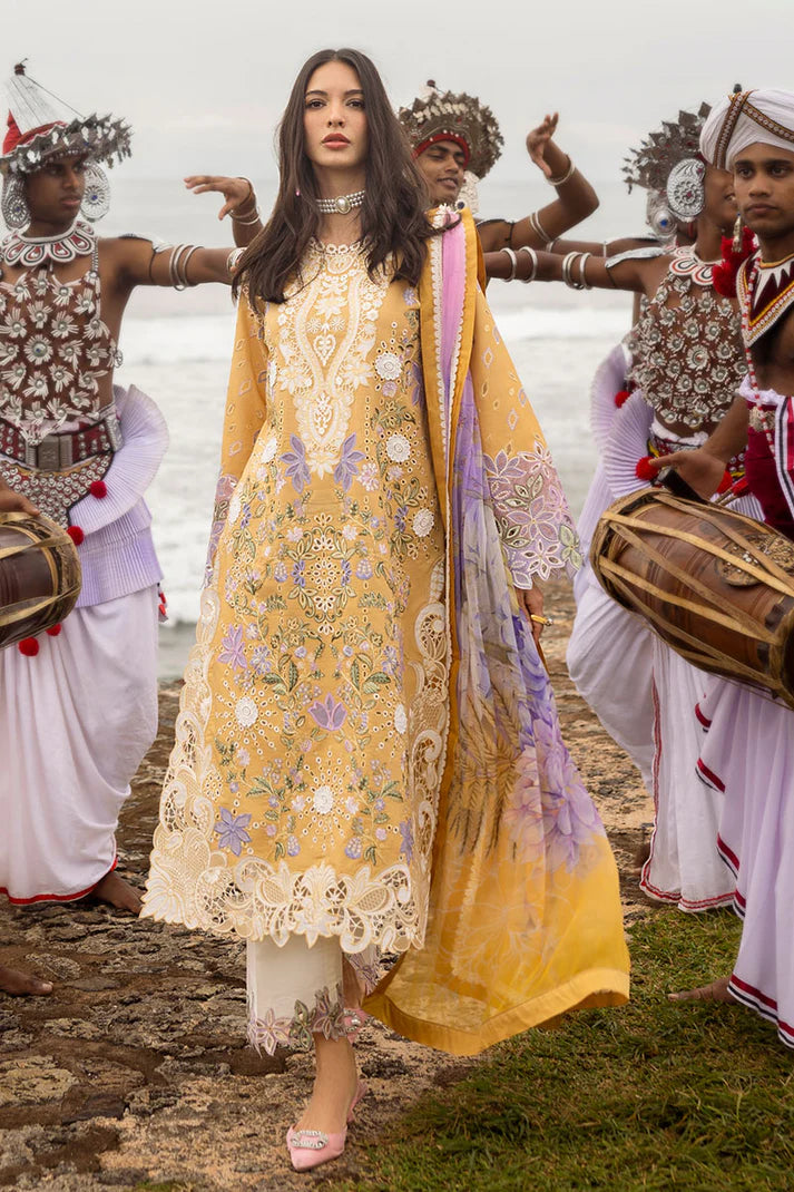 Model wearing mustard yellow embroidered floral shirt with lavender accents from Mushq Manaram Luxury Lawn 2025 Gold Glow. Pakistani clothes online UK.