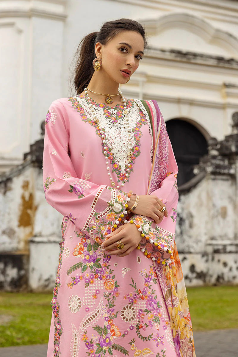 Model wearing blush pink embroidered dress with floral detailing and lace border from Mushq Manaram Luxury Lawn '25 Twinkling Tempos, Pakistani clothes online in UK.