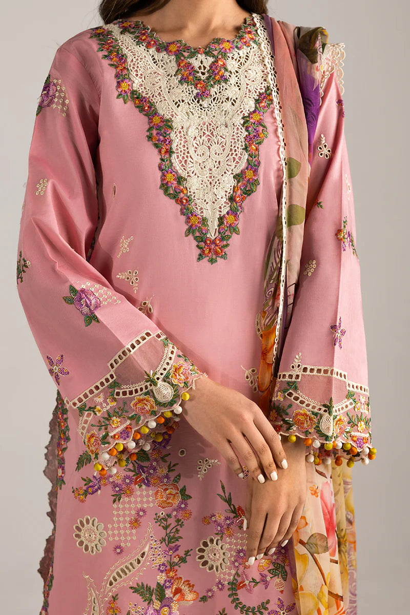 Model wearing blush pink embroidered dress with floral detailing and lace border from Mushq Manaram Luxury Lawn '25 Twinkling Tempos, Pakistani clothes online in UK.