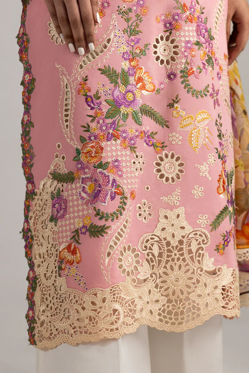 Model wearing blush pink embroidered dress with floral detailing and lace border from Mushq Manaram Luxury Lawn '25 Twinkling Tempos, Pakistani clothes online in UK.