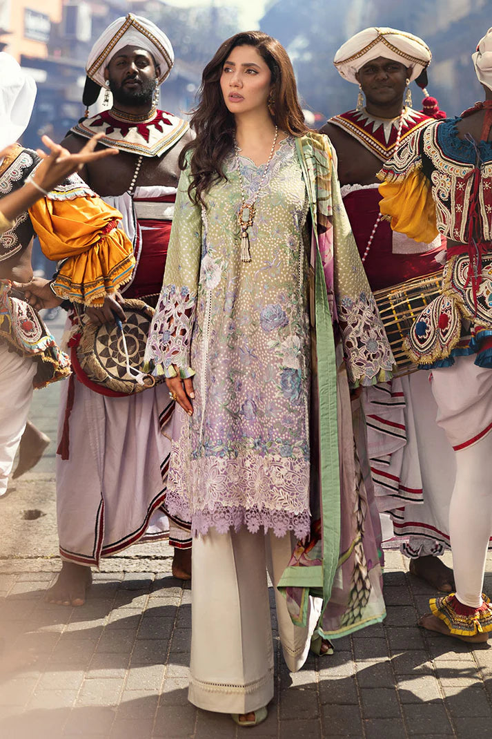 Model wearing pastel green and lavender embroidered dress from Mushq Manaram Luxury Lawn 2025 Glittering Grace. Pakistani clothes online UK.
