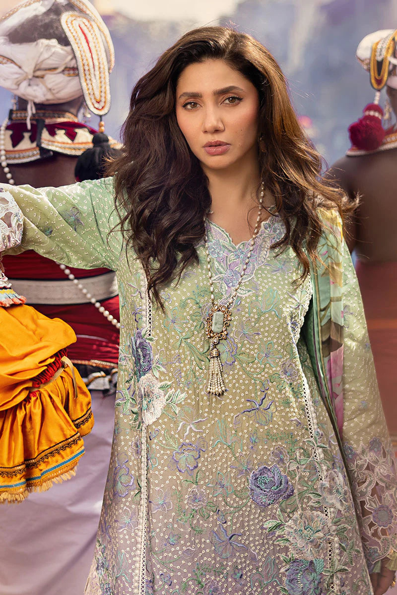 Model wearing pastel green and lavender embroidered dress from Mushq Manaram Luxury Lawn 2025 Glittering Grace. Pakistani clothes online UK.