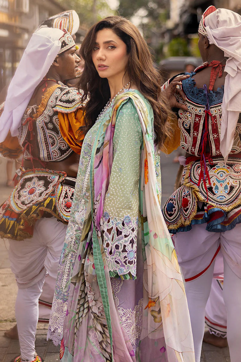 Model wearing pastel green and lavender embroidered dress from Mushq Manaram Luxury Lawn 2025 Glittering Grace. Pakistani clothes online UK.