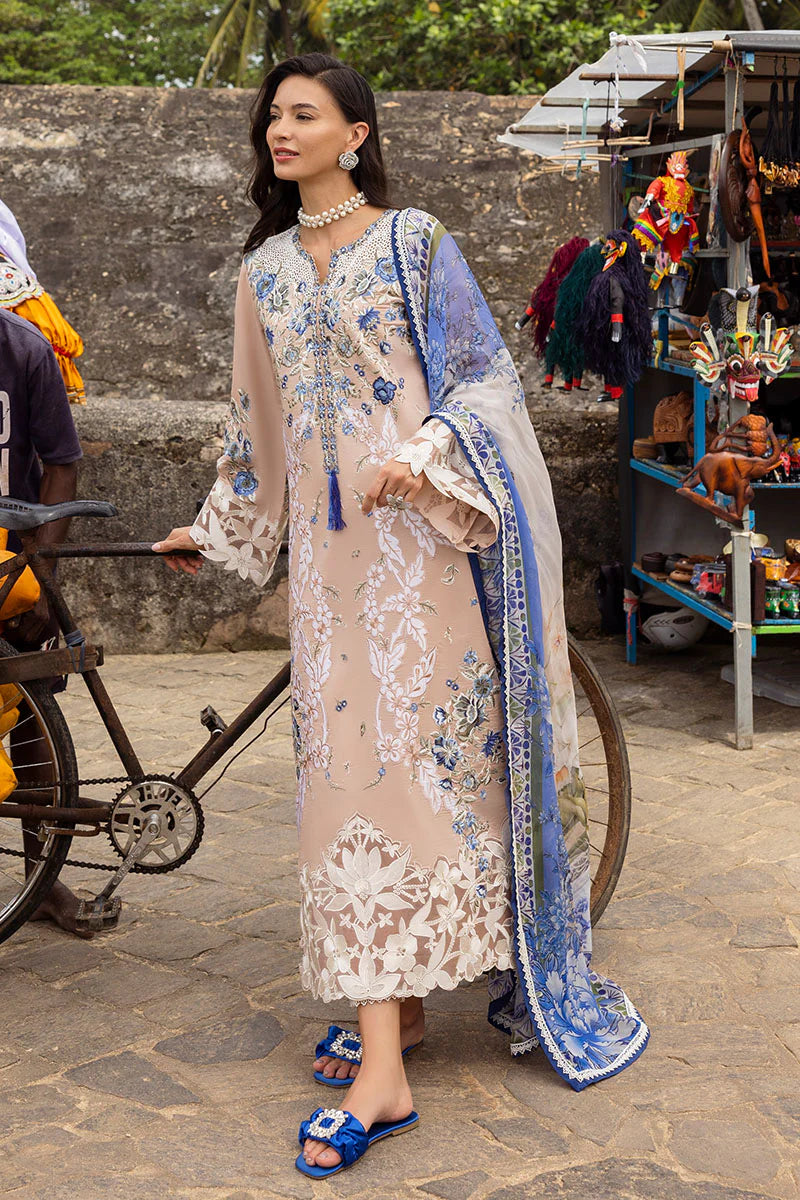 Model wearing beige and blue floral embroidered dress from Mushq Manaram Luxury Lawn '25 Glistening Groove, Pakistani clothes online in UK.