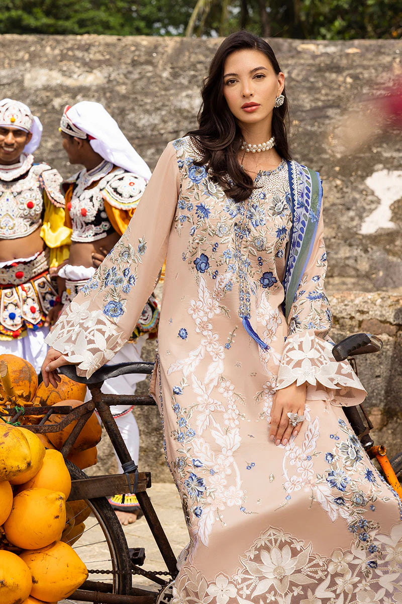 Model wearing beige and blue floral embroidered dress from Mushq Manaram Luxury Lawn '25 Glistening Groove, Pakistani clothes online in UK.