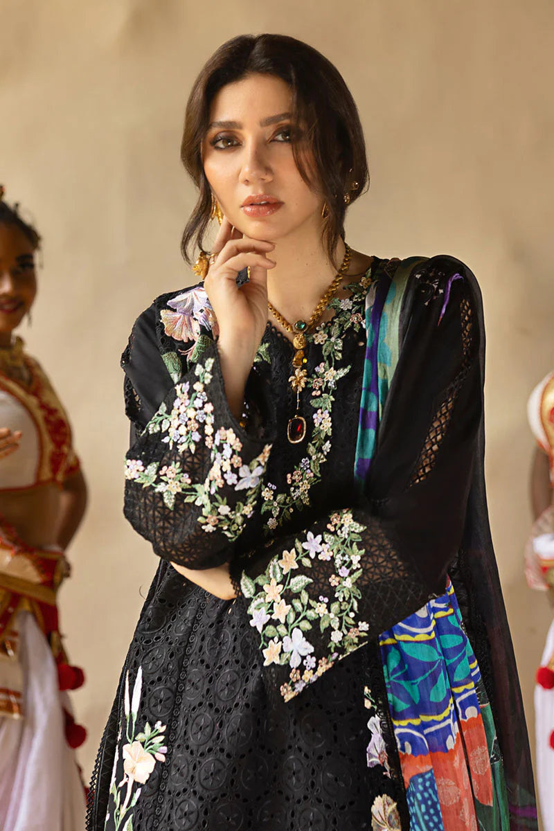 Model wearing black embroidered floral shirt with matching trousers and multicolour dupatta from Mushq Manaram Luxury Lawn 2025 Dazzling Glimmer. Pakistani clothes online UK.