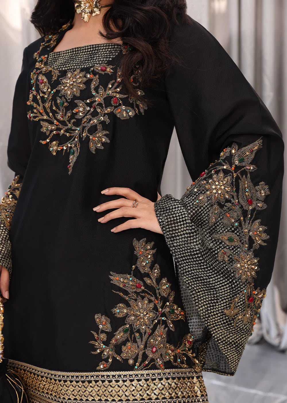 Model wearing black and gold embroidered dress with matching dupatta from Musferah Saad Midnight Bloom, Pakistani Luxury pret in UK.