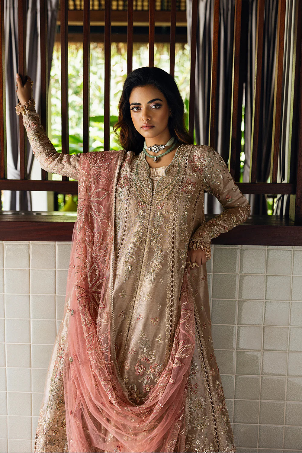 Model wearing Saira Rizwan ROHANA-SRF25-03 in champagne gold with pastel embroidery – Pakistani luxury pret, shop online in UK.