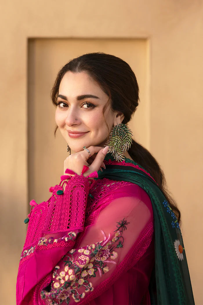 Model wearing hot pink embroidered three-piece suit with dark green printed dupatta from Saira Rizwan, Pakistani luxury pret, Pakistani clothes online in UK.